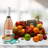 fruit basket with rose prosecco and truffles